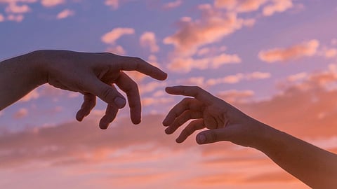 Couple reaching out