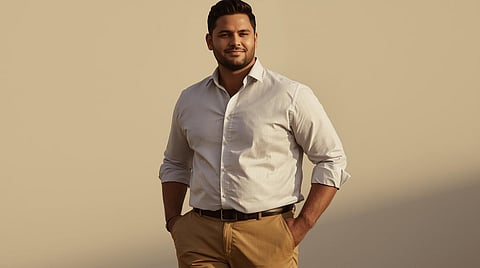 Plus size Indian man wearing a well-fitted smart casual outfit, standing confidently in an urban setting.