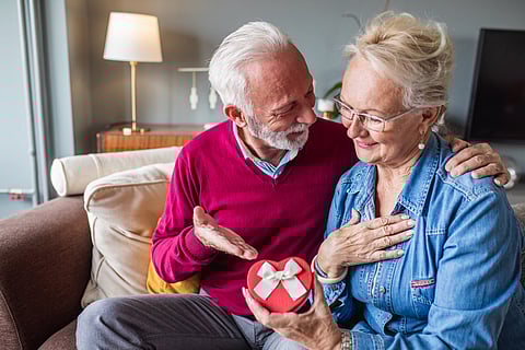 Elderly couples often appreciate gifts that celebrate family and shared memories. 