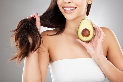Add eggs, almonds, salmon, sweet potatoes, and avocado to support hair growth and improve scalp health.