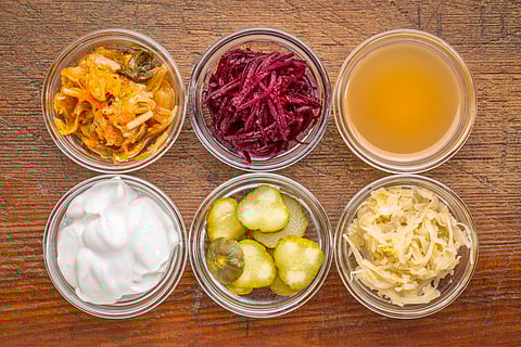 Fermented foods such as yogurt, kefir, kimchi, sauerkraut, miso, and tempeh are rich sources of postbiotics.