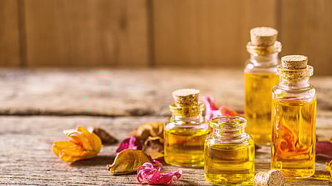 Vials of Kumkumadi oil on a table.