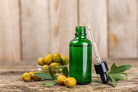 Squalane oil is derived from plant sources like olives or sugarcane, is more stable and skincare-friendly.