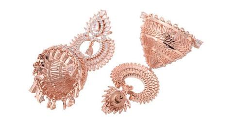 Rose gold dome-shaped jhumkas comes with American diamond studs.