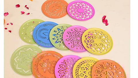 Here are the five Tamil New Year decor items including kolam, toran, floral hangings, rangoli stickers, and candle holders for festive home decoration.