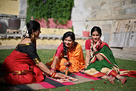 Women in diffrent drapes and saree styles.