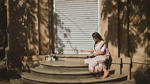 Women modelling a traditional cotton saree.