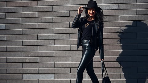 Women wearing a monochrome outfit for a elongated look.
