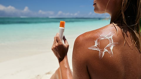 A women wearing sunscreen.