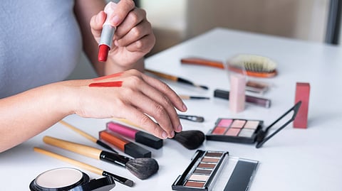 Women with various make-up products.