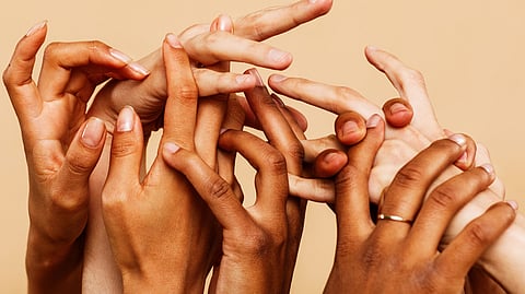 Various hands of women with diffrent skin tone an shades.