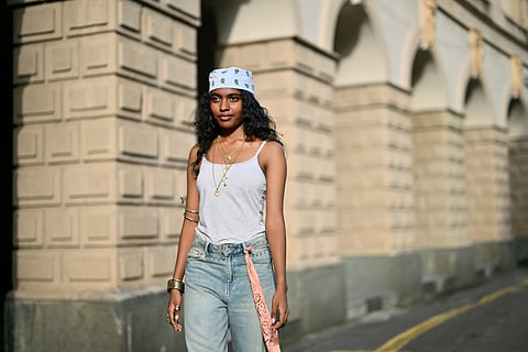 An indian women wearing blush pink accessories.