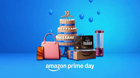 Amazon Prime Day 2026 promotional banner featuring a cake, smartphone, handbag, laptop, and blender.