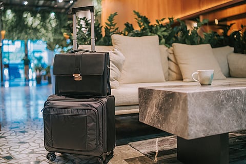 A bag and overnighter at a airport lounge.