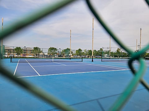 Four full-size tennis courts by the faculty housing.