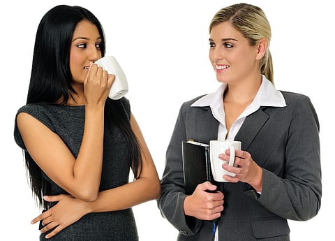 Coffee break for two gorgeous businesswomen