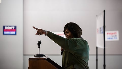Black woman raising her finger during speech