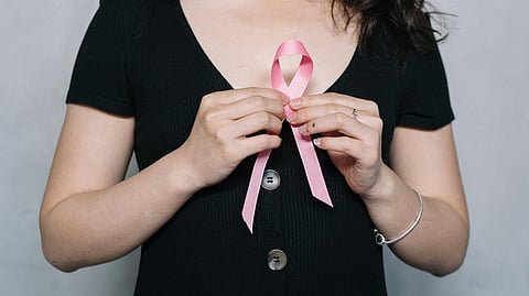 Woman Holding Pink Ribbon