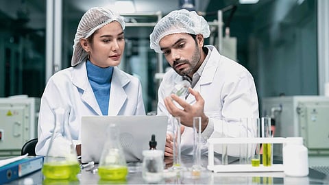 Two scientists working together in a lab.