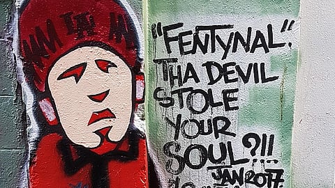 The image shows graffiti art with a message about fentanyl: 'Fentynal Tha Devil Stole Your Soul?!!.