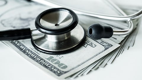 Close-up of cash and a stethoscope