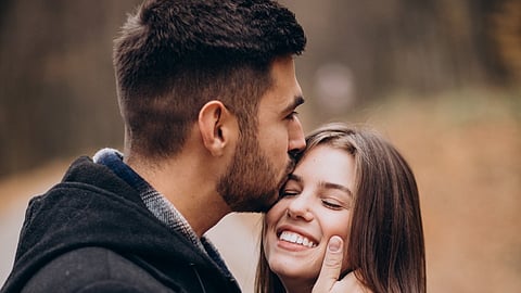 Young couple together walking in an autumn park