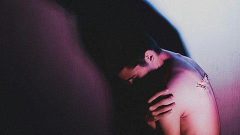 man embracing himself