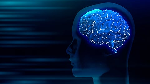 Digital illustration of a human brain with a glowing blue brain inside. 