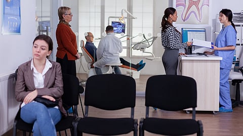 A person sitting in waiting area for clinical consultation