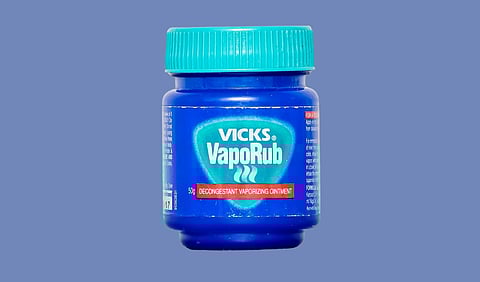 A blue jar of vicks vaporub.

