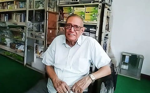 Dr. TA Kanaga Rathinam wearing a white shirt.