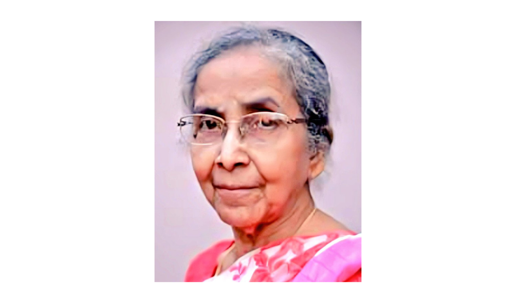 A picture of Dr. Shobha Chakraborty wearing a pink saree 