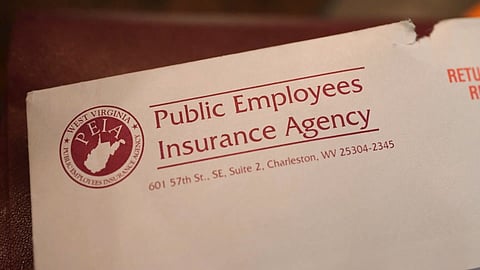 A white colored envelope with a red marked label displaying "Public Employees Insurance Agency".