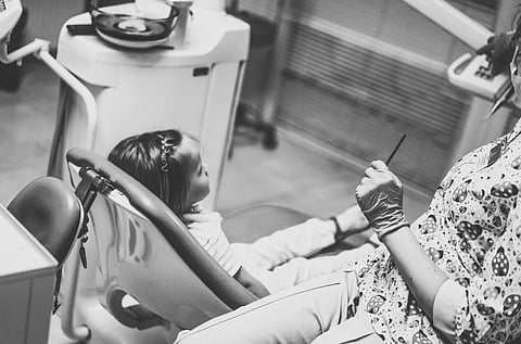 little girl at the dentist