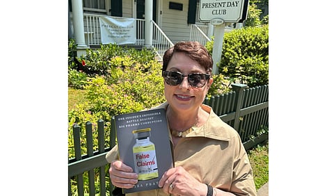 Lisa Pratta with her book