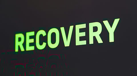 'RECOVERY' written in bold letters in black background.