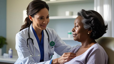 A doctor gently examines a patient's chest in a medical office.
