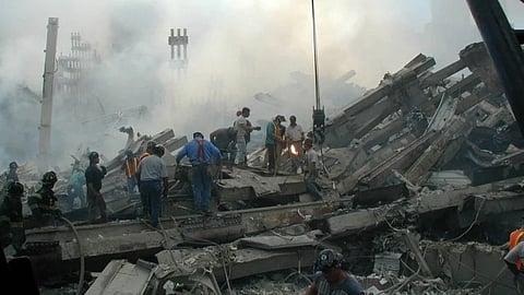 The image shows professionals and volunteers, working at Ground Zero on 9/11.
