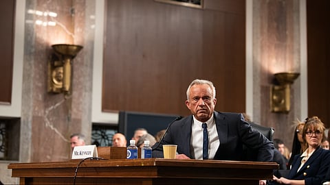 An image of Health and Human Services Secretary Robert F. Kennedy Jr. speaking in a public meeting.