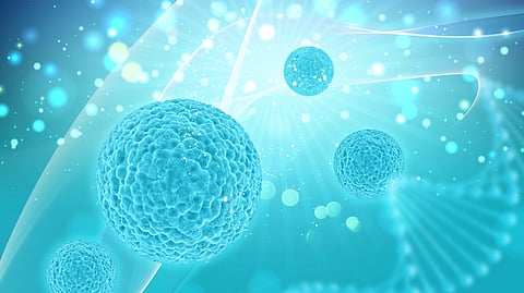An ocean-blue colored illustration which shows 4 round structures with some light- colored particles in between them. 