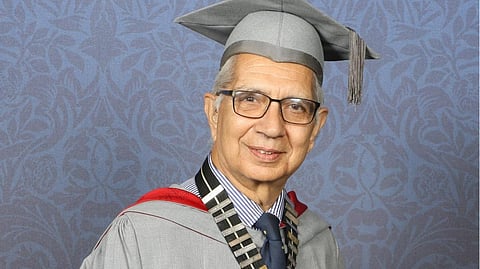 Dr. Shiv Pande wearing a graduation attire