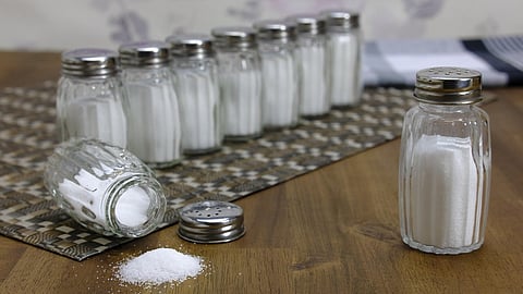  The image shows multiple bottles of table salt, highlighting excessive consumption.
