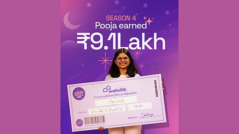 Picture of the winner, Pooja Madhav Wavhal, holding a ₹9.1 Lakh check in her hands.