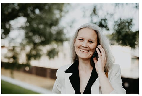 An elderly woman in a phone call.