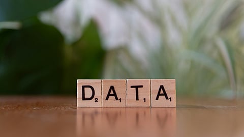 Data block on wooden table, symbolizing fears of veteran DNA research going to waste.