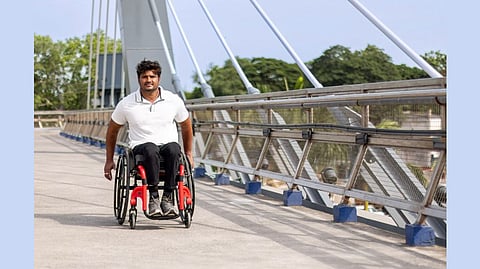 A man is using the newly launched YD One wheelchair on the bridge.
