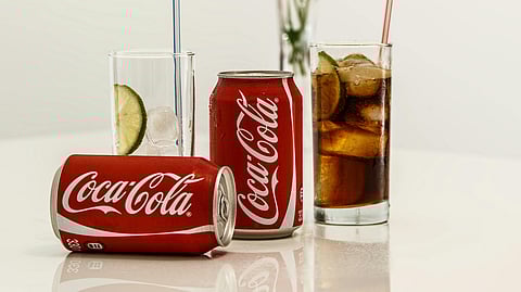 Coca Cola Cans and Glasses With Lines