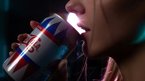 Woman sipping Pepsi, symbolizing sugar’s impact on gut microbes and immunity.