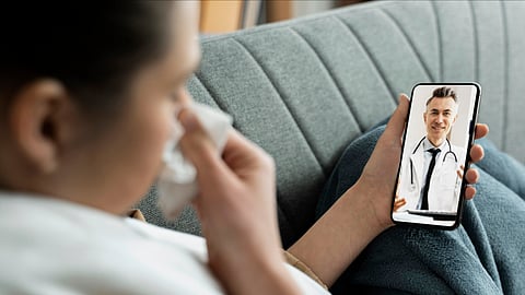 A woman taking a tele-consultation using a mobile.