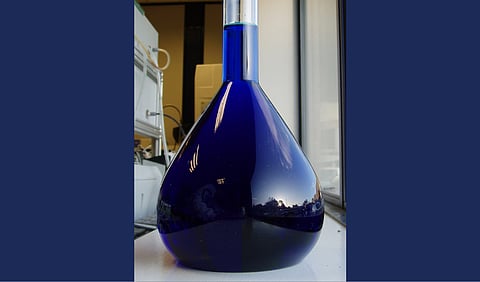 A volumetric flask filled with methylene blue